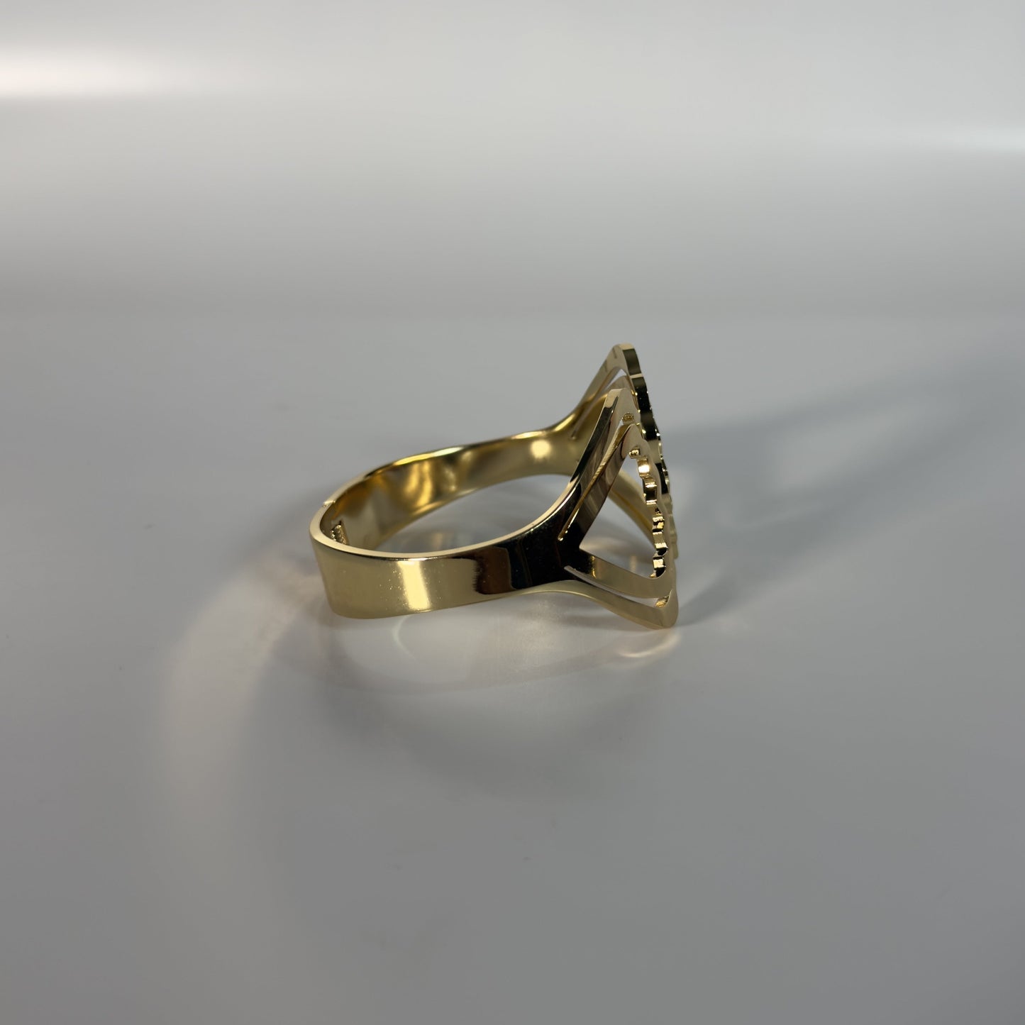 Gold ring on a gray background