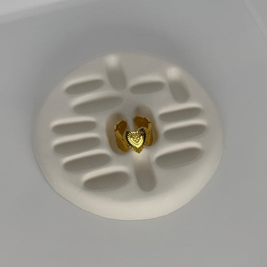 White ceiling light fixture with a gold heart-shaped component on a white background